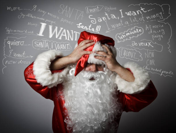 istock Frustrated Santa Claus and many wishes 654385996