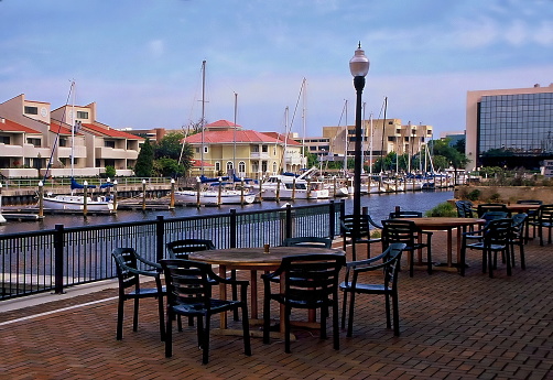 Pair of tables overlooking boats docked at Palafox Pier - Pensacola, Florida
