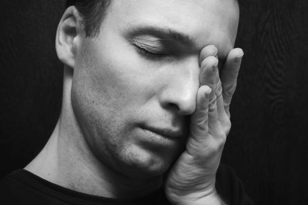 istock Young stressed Caucasian man closeup 654398282