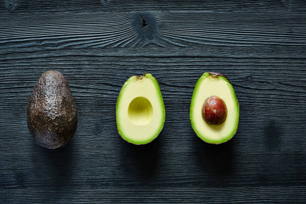 istock three states of avocado original halfed and stone 654401032