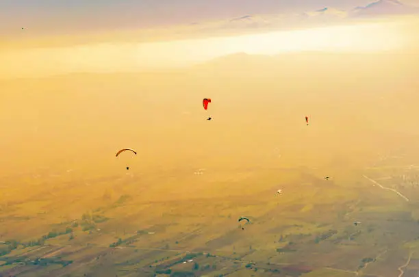 Photo of Paraglider. Parachuter. Paragliding in mountains