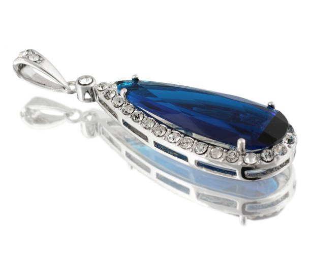 istock Pendant with blue gem isolated on white background 654404868