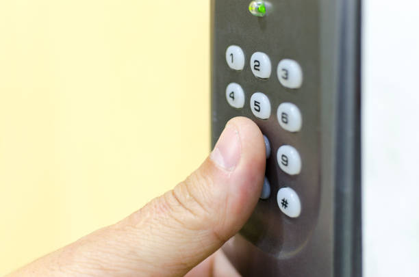 istock Opening the door with number combination with hand 654404900