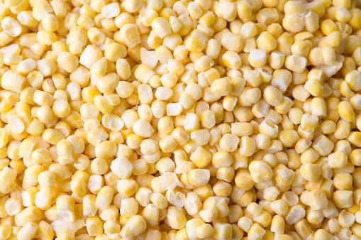 Frozen sweet corn forming a background pattern