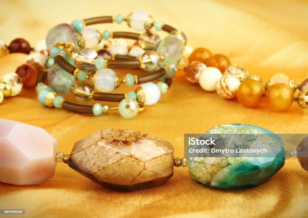jewelry gems on golden background Arrangement Stock Photo