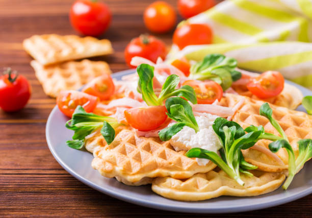 istock Waffles sandwich with bacon, cherry tomatoes and corn salad 654405302