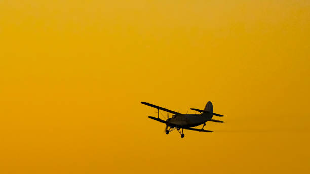 istock Airplane flying in the sky spraying mosquitoes 654405320