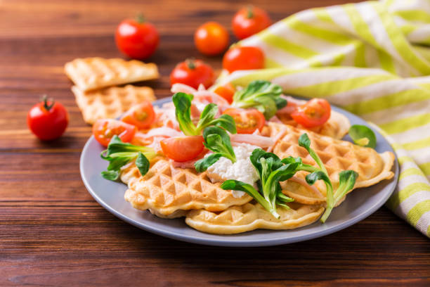 istock Waffles sandwich with bacon, cherry tomatoes and corn salad 654405342