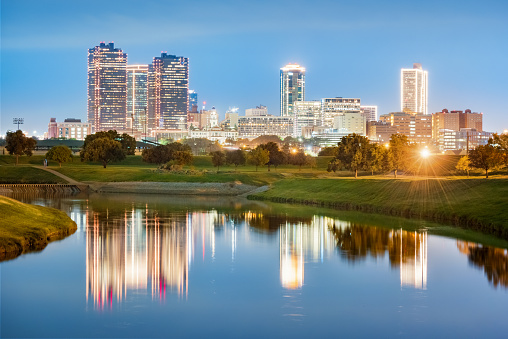 Stock photo of the skyline of downtown Fort Worth reflecting in the West Fork Trinity River in Texas, USA.