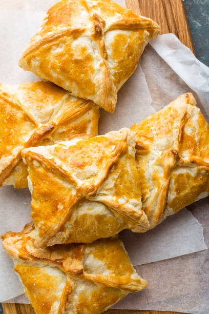 istock Crunchy puff pastry pies, homemade baking, top view 654412062