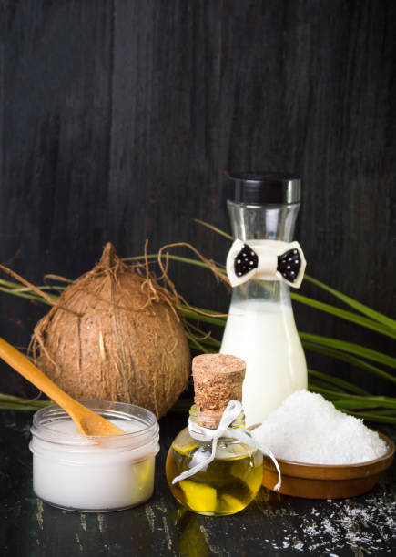 Coconut products set on black background
