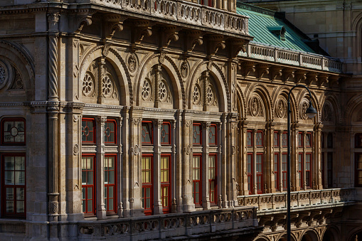 Detail view of the facade of the Vienna Opera House, Vienna, Austria with dramatic side lighting