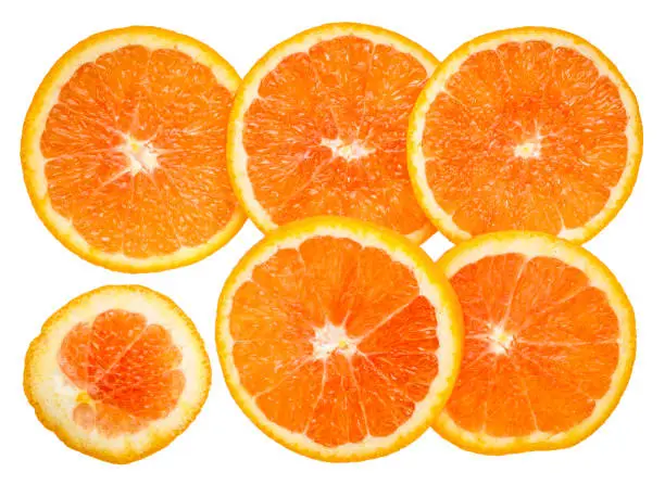 background and texture of fresh orange slices isolated on white