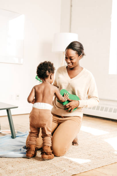 istock Mother playing music for toddler 654439956