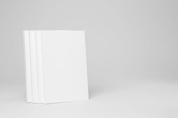 istock Real paperback white books on a gray background 654443888