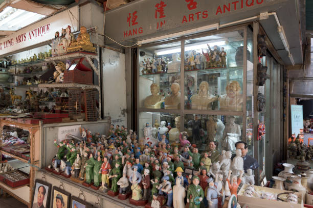 Antique Shop Display in Cat Street in Hong Kong Hong Kong, Hong Kong S.A.R. - January 26, 2017:Antique Shop Display in Cat Street in Hong Kong. Hollywood Road, Upper Lascar Row aka Cat Street is a major tourist attraction in Hong Kong. antique chinese dolls pictures stock pictures, royalty-free photos & images