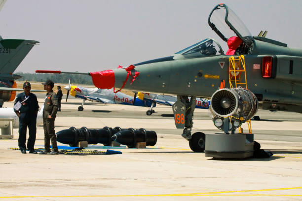 Two american airforce pilots doing a preflight check before taking off.
