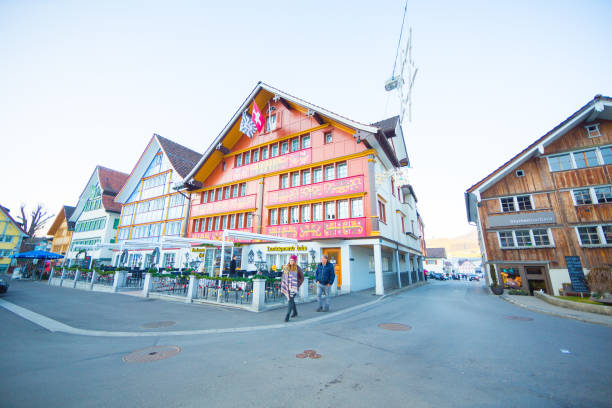 Family Walk in Downtown Appenzel District On december 29th 2016, family of tourists walk inside of the Appenzell District in Switzerland where restaurants and hotels are located. appenzell innerrhoden stock pictures, royalty-free photos & images