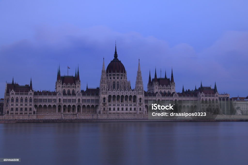 Parliament at twilight with long exposure in Budapest An evening photo with long exposure of the famous Parliament building in Budapest. Architectural Column Stock Photo
