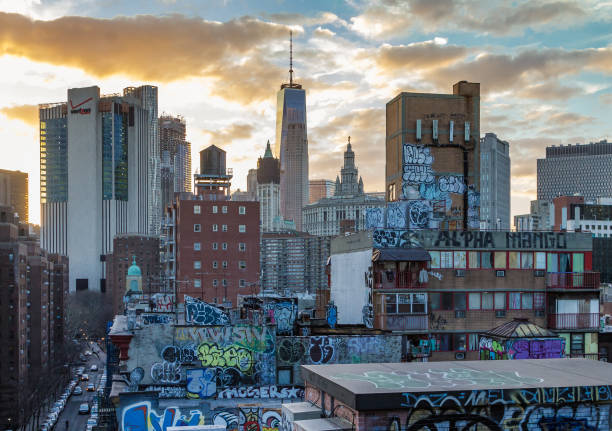 NEW YORK CITY - FEBRUARY 24: The sun sets behind the Skyscrapers of the Manhattan skyline as seen from the Manhattan Bridge in New York City on February 24th, 2017.