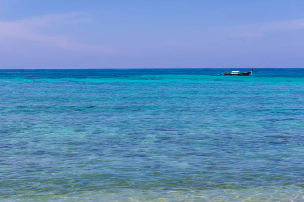 istock Ocean View with Wooden Small Boat 654497776