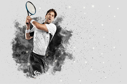 Tennis Player with a white uniform coming out of a blast of smoke .