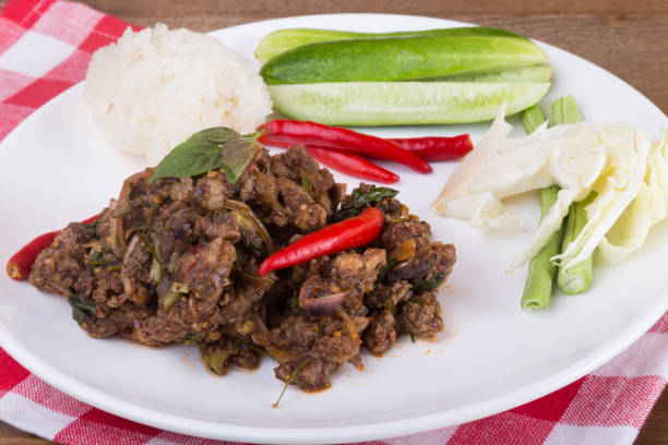 istock Spicy Thai minced beef salad with sticky rice 654506858