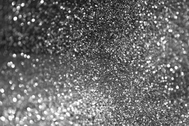 istock glitter lights grunge background, glitter defocused abstract Twinkly Lights and glitter Stars Christmas light Background. 654511224
