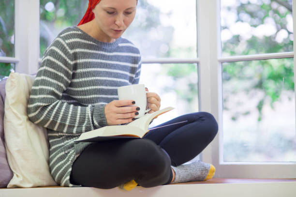 istock Young attractive Caucasian woman with cancer drinking tea 654527182