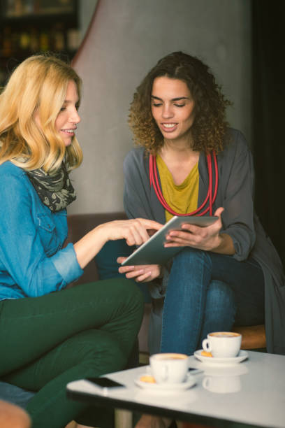istock Female friends in cafe 654544084