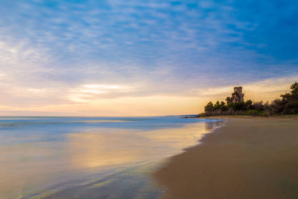 Pineto (Abruzzo, Italy) The sunrise on the Adriatic sea, from the Pineto beach, beside the Torre di Cerrano castle abruzzi photos stock pictures, royalty-free photos & images