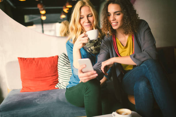 istock Female friends in cafe 654547478
