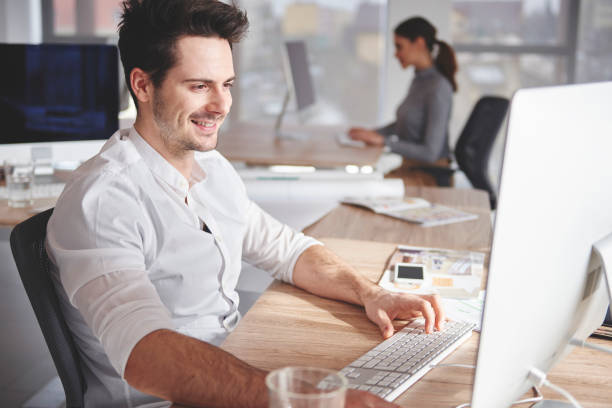 istock Busy coworkers in place of work 654557140