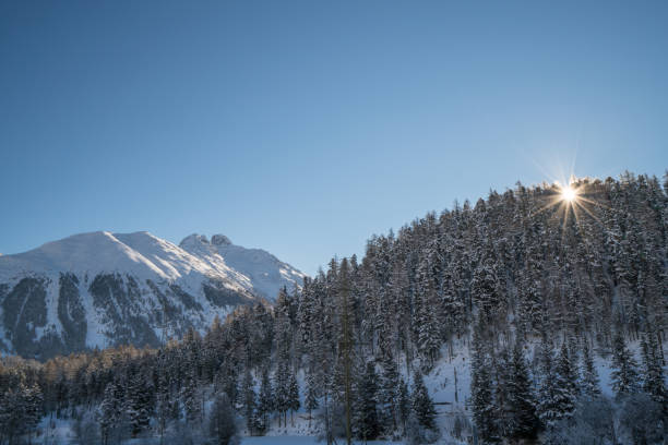 Beautiful view of the sunrise over the European Alps in St Moritz, Switzerland. Winter, no people, landscape.