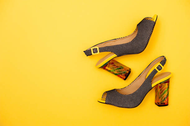 Elegant Lady Sandals On Yellow Background
