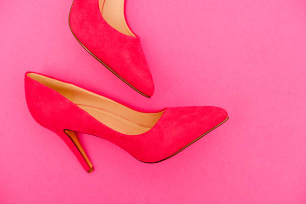 istock Vibrant Pink Shoe On Pink Background 654567860