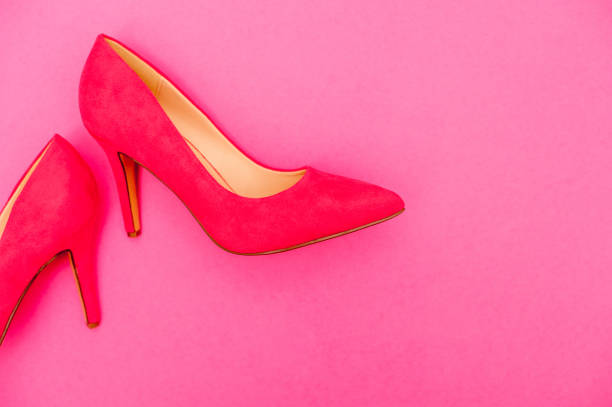 istock Vibrant Pink Shoe On Pink Background 654567878