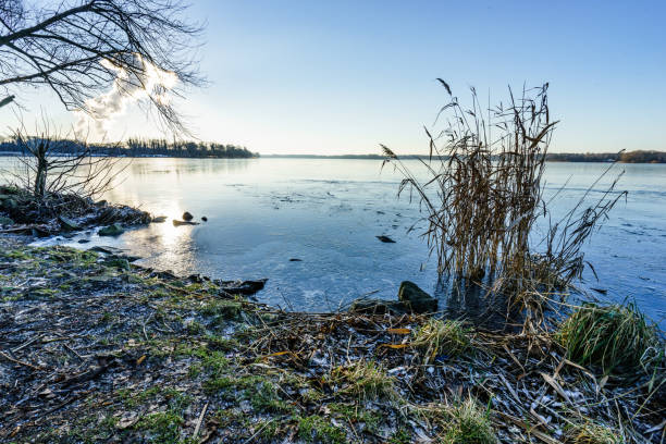 istock sunset over a snow covered lake in winter 654567912