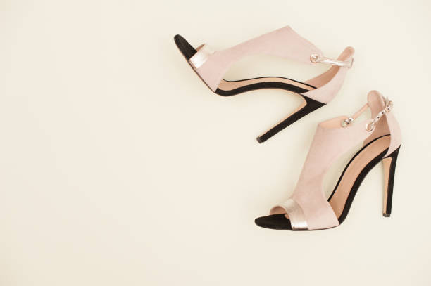 istock Pair Of Elegant Woman Sandals On White Background 654567964