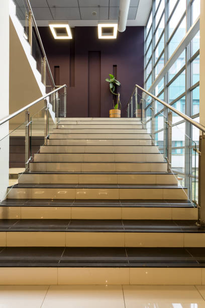 istock Stairs with tiles and metal railing 654570114