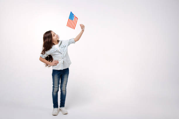 istock Joyful girl representing the American nation in the studio 654570918