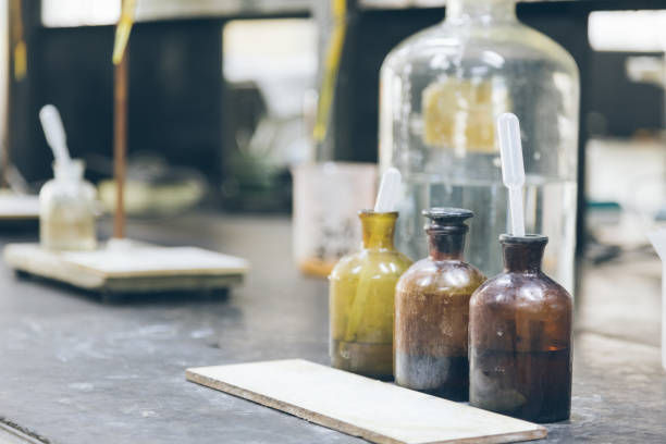 istock Beakers and equipment on table in factory laboratory 654573412