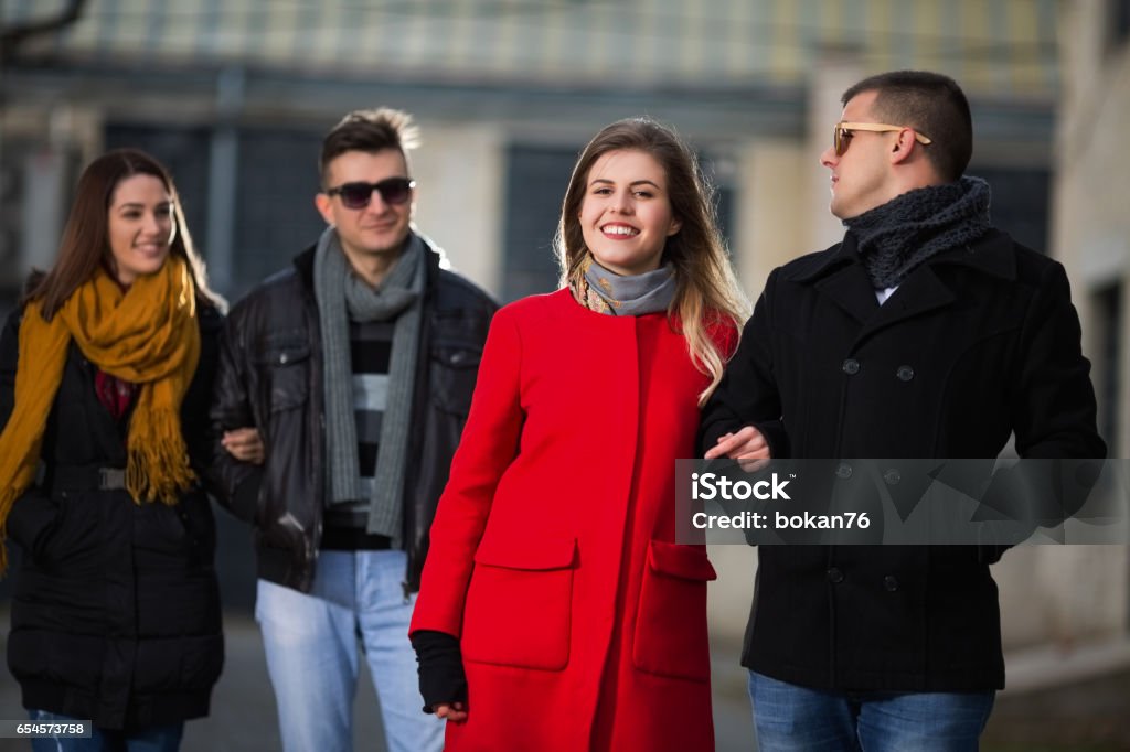 Young people outdoors Young people outdoors walking and talking Adult Stock Photo