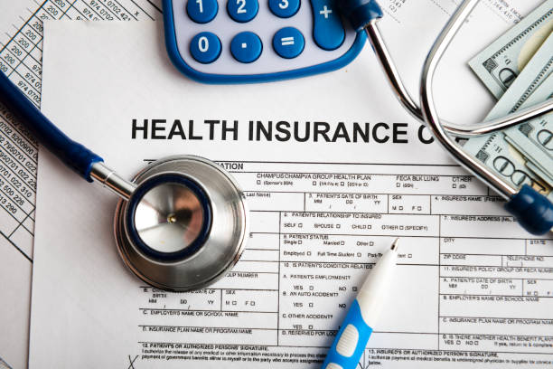 istock Health insurance application form with banknote and stethoscope concept for life planning 654573948