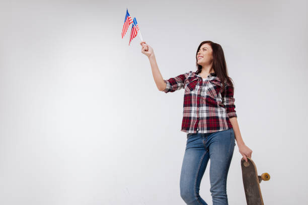 istock Sunny young woman representing American nation in the studio 654581262