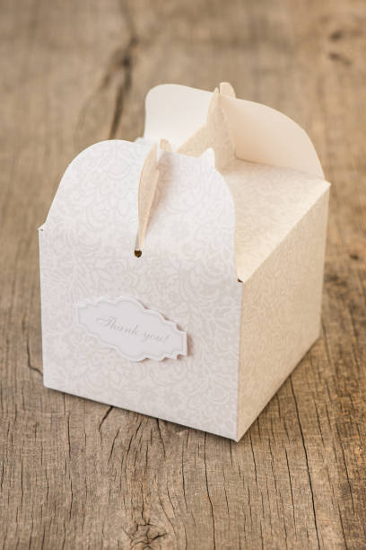 istock Paper gift box on wooden background 654581442