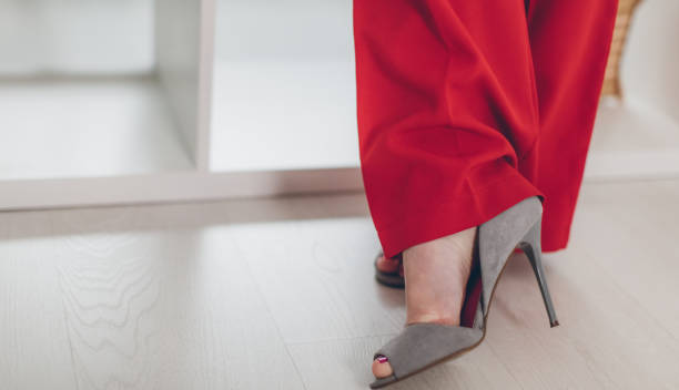 istock Woman in red shoes 654587810