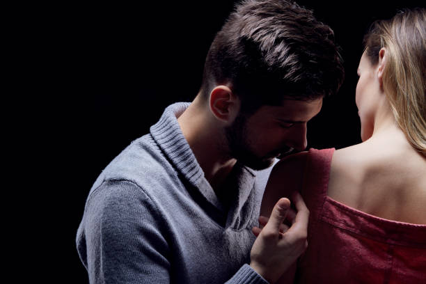 istock Man kissing his girlfriend's shoulder 654590872