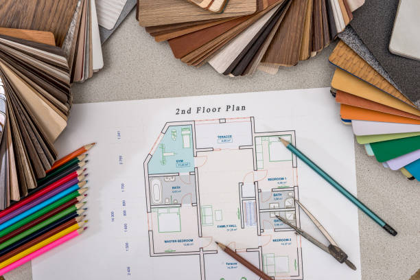 istock plan house with wooden models, pencils, pen on the table. 654597534