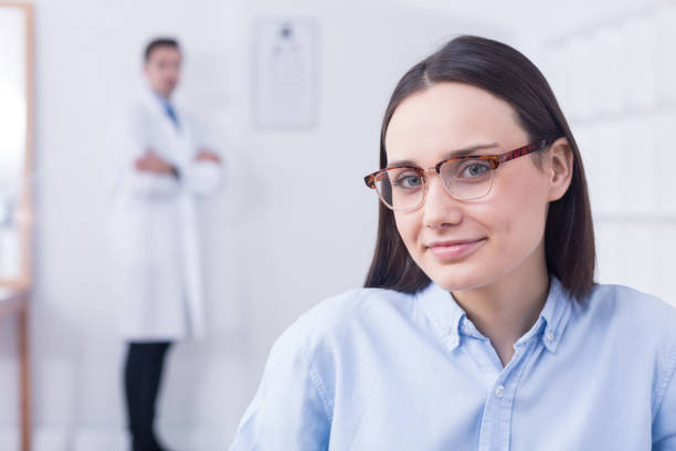istock Woman choosing new eyeglasses 654603576